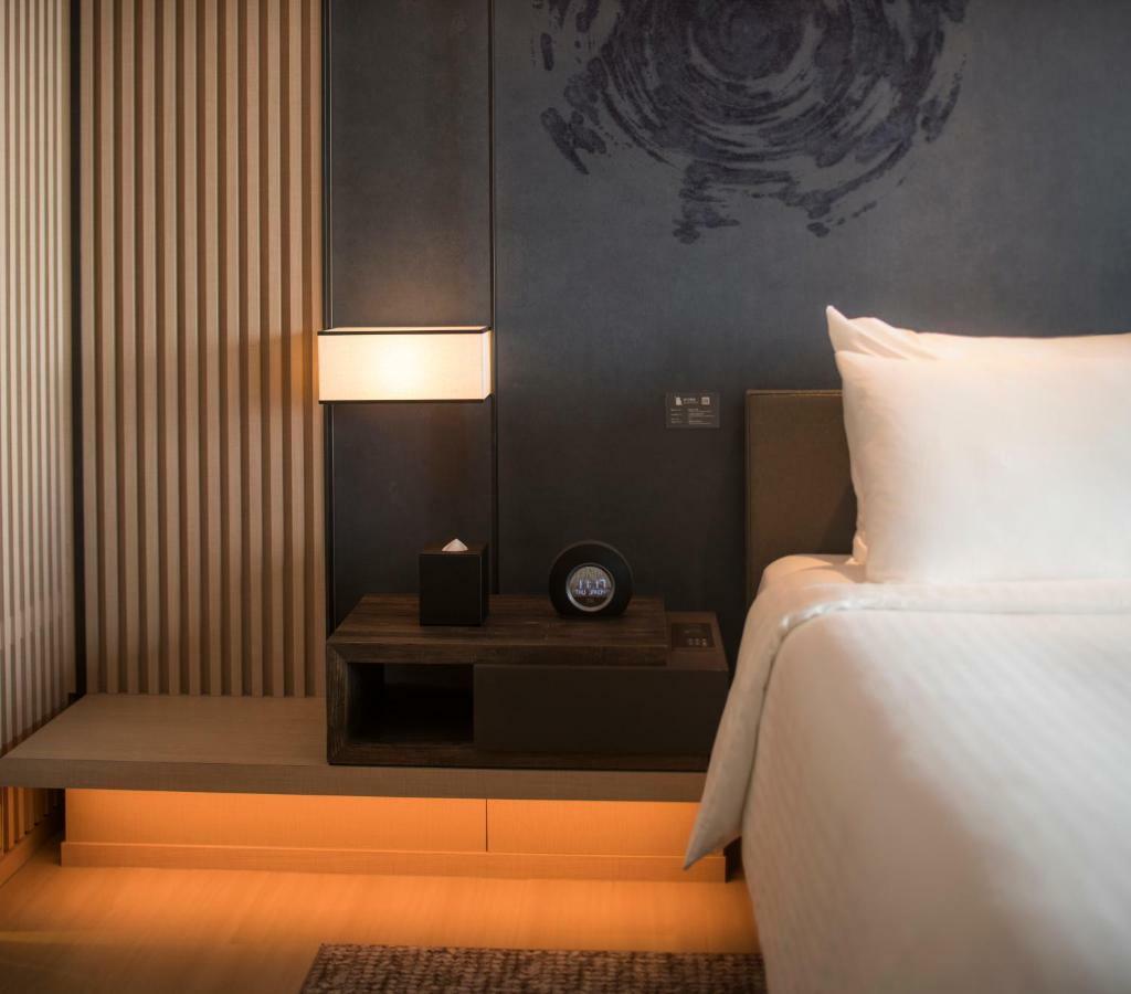 Mu Jiaoxi Hotel מראה חיצוני תמונה A room at the hotel