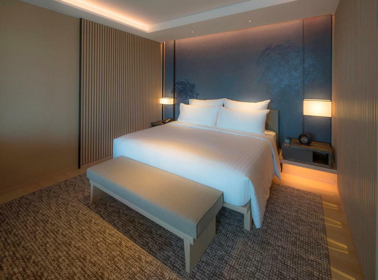 Mu Jiaoxi Hotel מראה חיצוני תמונה A bedroom at the hotel